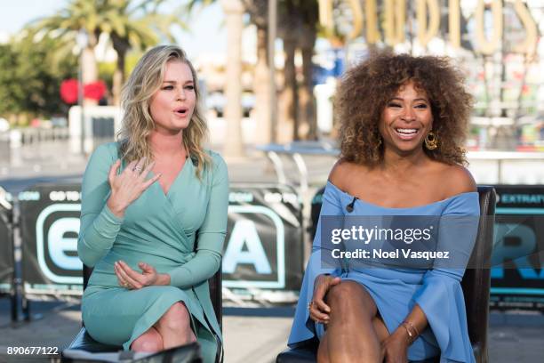 Rebecca Romijn and Tanika Ray visit "Extra" at Universal Studios Hollywood on December 11, 2017 in Universal City, California.