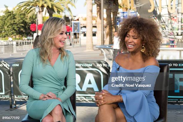 Rebecca Romijn and Tanika Ray visit "Extra" at Universal Studios Hollywood on December 11, 2017 in Universal City, California.