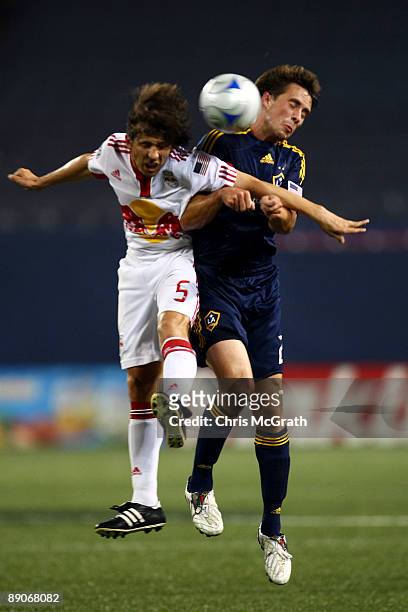 Albert Celades of the New York Red Bulls battles for the ball against Todd Dunivant of the LA Galaxy at Giants Stadium in the Meadowlands on July 16,...