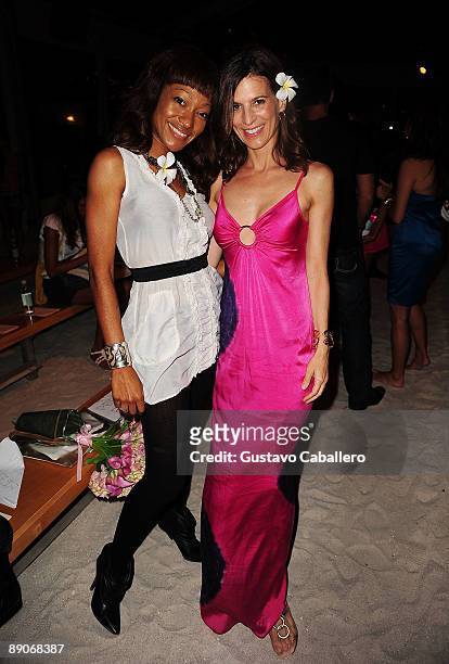Tanya Sergei and actress Perry Reeves attend the Marysia Swim 2010 fashion show during Mercedes-Benz Fashion Week Swim at Oasis at The Raleigh on...