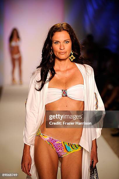 Model walks the runway at the Caffe Swimwear 2010 fashion show during Mercedes-Benz Fashion Week Swim at the Beachway at The Raleigh on July 16, 2009...