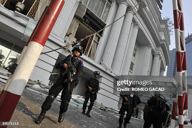 Indonesian counter-terrorist police commandos secure the damaged Ritz-Carlton hotel in Jakarta on July 17, 2009 after an explosion hit the...