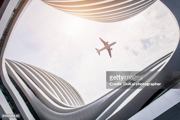 modern architecture in beijing - airplane exterior stock pictures, royalty-free photos & images