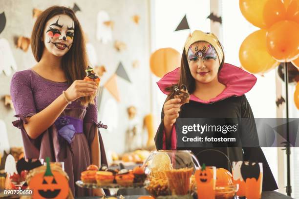 witch's cupcakes - orange cupcake stock pictures, royalty-free photos & images
