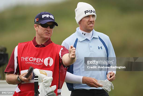 Hunter Mahan of USA lines up a shot with caddy John Wood during round two of the 138th Open Championship on the Ailsa Course, Turnberry Golf Club on...