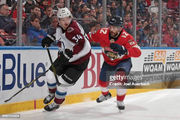 Ian McCoshen of the Florida Panthers pursues Carl Soderberg of the Colorado Avalanche as he chases a loose puck at the BB&T Center on December 9,...