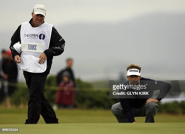 Golfer David Toms lines up his putt on the 2nd green on the second day of the 138th British Open Championship at Turnberry Golf Course in south west...