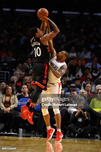 DeMar DeRozan of the Toronto Raptors attempts a jump shot against Sindarius Thornwell of the Los Angeles Clippers on December 11, 2017 at STAPLES...