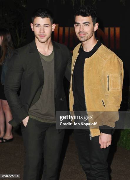 Nick Jonas and brother Joe Jonas attend the Los Angeles Premiere "Jumanji: Welcome To The Jungle" at the TCL Chinese Theatre on December 11, 2017 in...