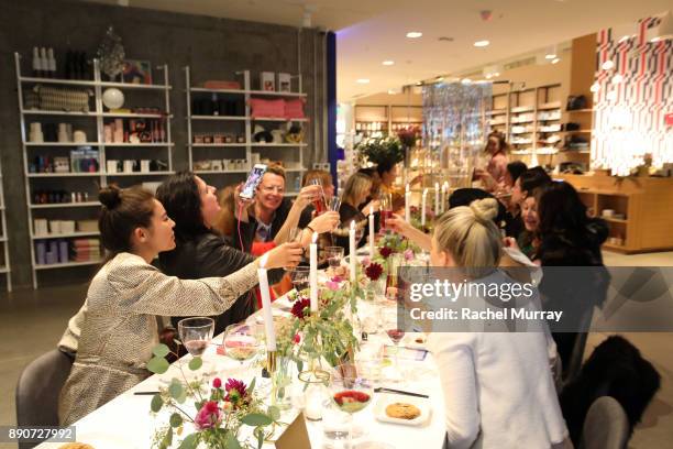 Guests attend the Domino Outpost + CB2 Influencer Dinner at Fred Segal on December 11, 2017 in Los Angeles, California.