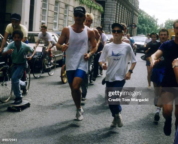 Madonna at The Mayfair Hotel jogging with personal trainer and bodyguards