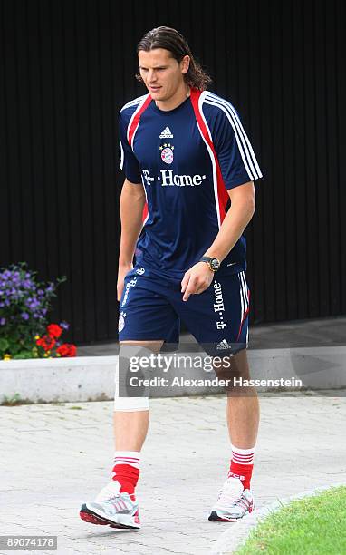 Daniel van Buyten walks injured at the teamsquad 'Der Oeschberghof' on day two of the FC Bayern Muenchen training camp on July 17, 2009 in...