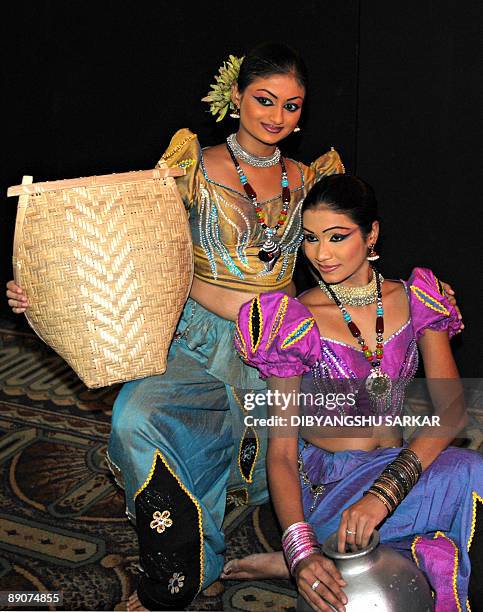 Sri Lankan dancers perform during an event to promote their country's tourism industry in Bangalore on July 17, 2009. The tourism event was organised...