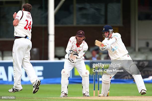 Tom Smith of Lancashire takes evasive action as Chris Woakes of Warwickshire plays a shot during Day 3 of the LV County Championship Division One...