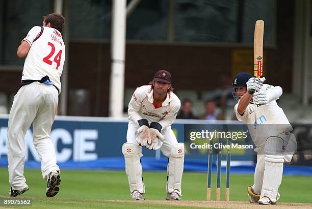 Chris Woakes of Warwichshire plays delivery past Luke Sutton and Tom Smith of Lancashire during Day 3 of the LV County Championship Division One...