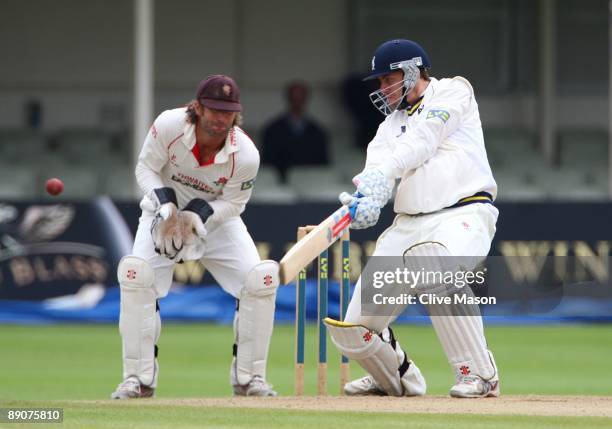 Rikki Clarke of Warwichshire plays a delivery as Luke Sutton of Lancashire keeps wicket during Day 3 of the LV County Championship Division One match...