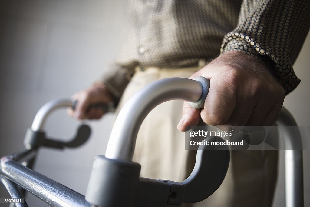 Man using walking frame