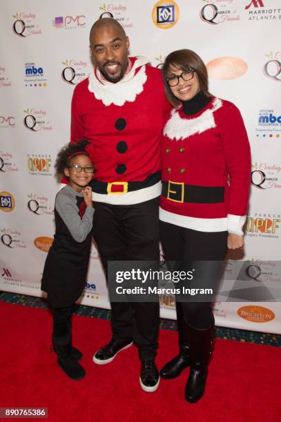 Montell Jordan, wife Kristin Hudson and daughter attend the '5th Annual Caroling with Q Parker and Friends' at Atlanta Marriott Buckhead on December...