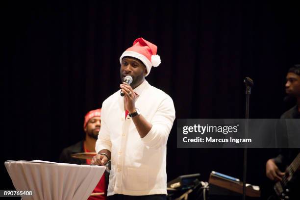 Parker performs onstage during the '5th Annual Caroling with Q Parker and Friends' at Atlanta Marriott Buckhead on December 11, 2017 in Atlanta,...