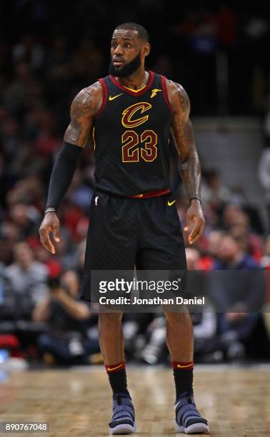 LeBron James of the Cleveland Cavaliers looks over at the bench against the Chicago Bulls at the United Center on December 4, 2017 in Chicago,...
