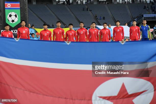 North Korean players line up for the national anthems prior to the EAFF E-1 Men's Football Championship between North Korea and South Korea at...