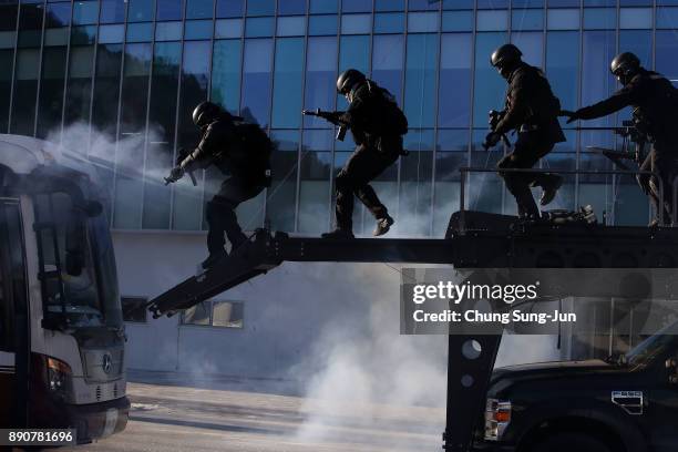 South Korean special police participate in an anti-terror drill at the Olympic Staduim, venue of the Opening and Closing ceremony on December 12,...
