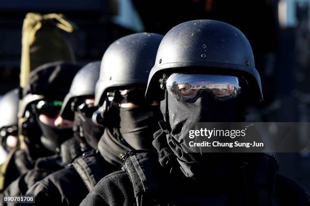 South Korean special police participate in an anti-terror drill at the Olympic Staduim, venue of the Opening and Closing ceremony on December 12,...