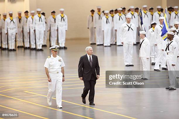 Defense Secretary Robert Gates reviews recruits with Captain John Peterson, Commanding Officer of Recruit Training Command, during a graduation...