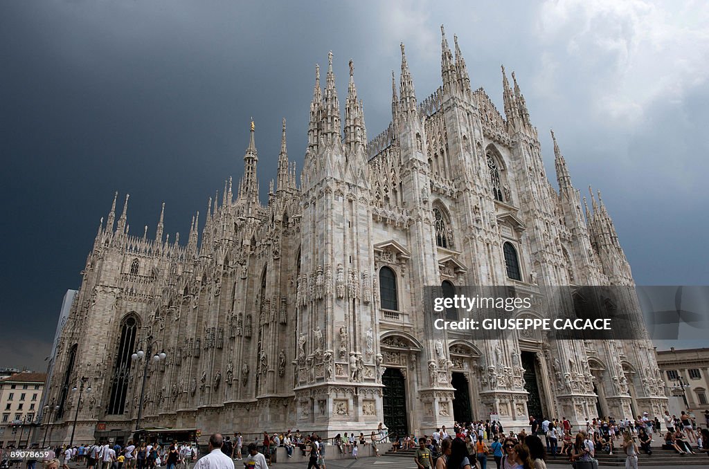 People walk on Duomo Square during in Mi