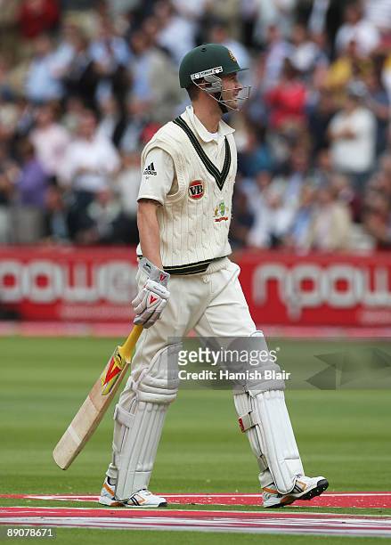 Michael Clarke of Australia walks back after being dismissed by James Anderson of England during day two of the npower 2nd Ashes Test Match between...