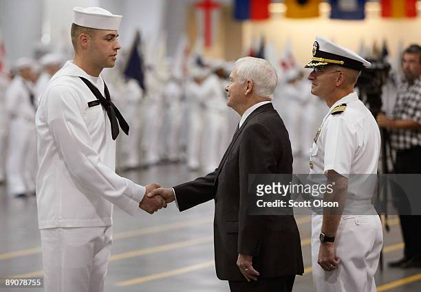 Defense Secretary Robert Gates with Captain John Peterson , Commanding Officer of Recruit Training Command, greet award recipient Seaman Recruit...