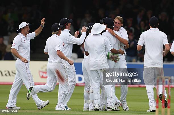 Stuart Broad of England celebrates the wicket of Brad Haddin of Australia with team mates and captain Andrew Strauss during day two of the npower 2nd...