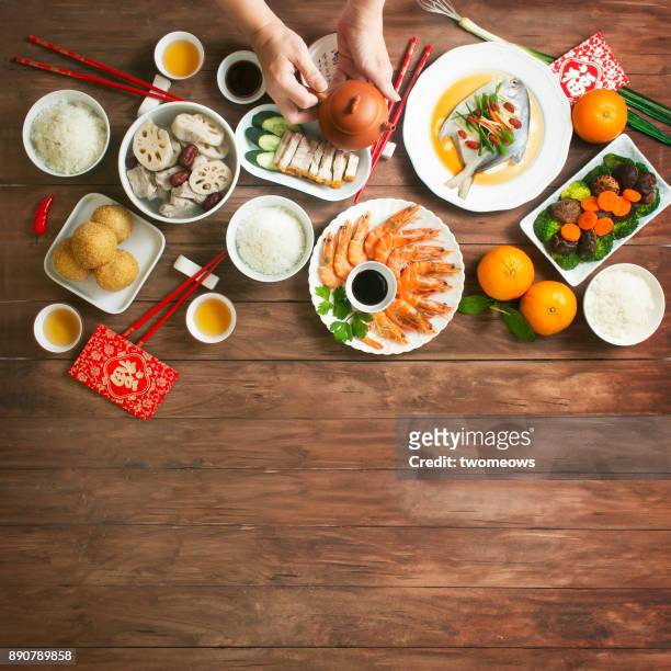 flat lay chinese new year reunion dinner, food and drink. - lunar new year cup 2017 stock-fotos und bilder
