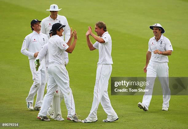 Stuart Broad of England celebrates the wicket of Brad Haddin of Australia with Alastair Cook during day two of the npower 2nd Ashes Test Match...
