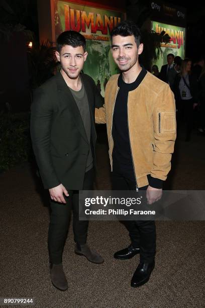 Nick Jonas and Joe Jonas attend the premiere of Columbia Pictures' "Jumanji: Welcome To The Jungle" on December 11, 2017 in Hollywood, California.