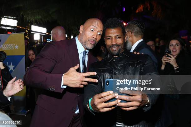 Dwayne Johnson and Deon Cole attend the premiere of Columbia Pictures' "Jumanji: Welcome To The Jungle" on December 11, 2017 in Hollywood, California.