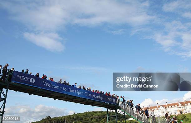 Spectators cross the bridge opposite the Turnberry Hotel during round two of the 138th Open Championship on the Ailsa Course, Turnberry Golf Club on...