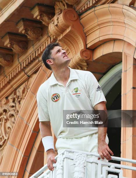 Michael Hussey of Australia waits for the rain to stop during day two of the npower 2nd Ashes Test Match between England and Australia at Lord's on...