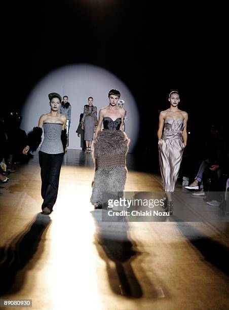 Models walk the catwalk at a show to honour Giles Deacon at Victoria & Albert Museum on July 17, 2009 in London, England.