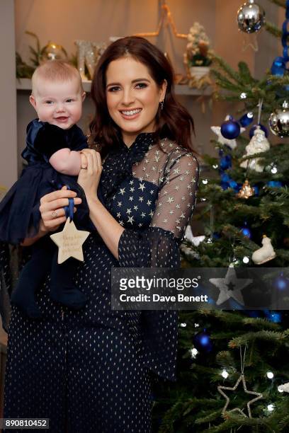 Binky Felstead wishes on a star for her baby India to launch Aptaclub's Christmas Wishes campaign on December 12, 2017 in London, England.