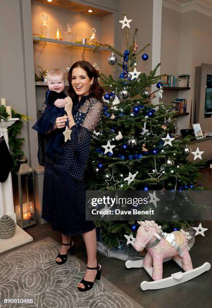 Binky Felstead wishes on a star for her baby India to launch Aptaclub's Christmas Wishes campaign on December 12, 2017 in London, England.