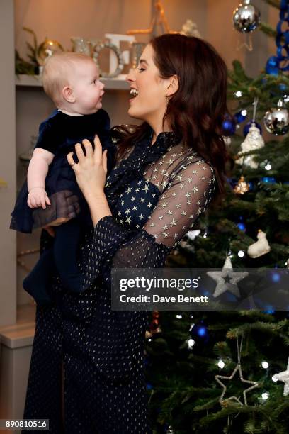 Binky Felstead wishes on a star for her baby India to launch Aptaclub's Christmas Wishes campaign on December 12, 2017 in London, England.