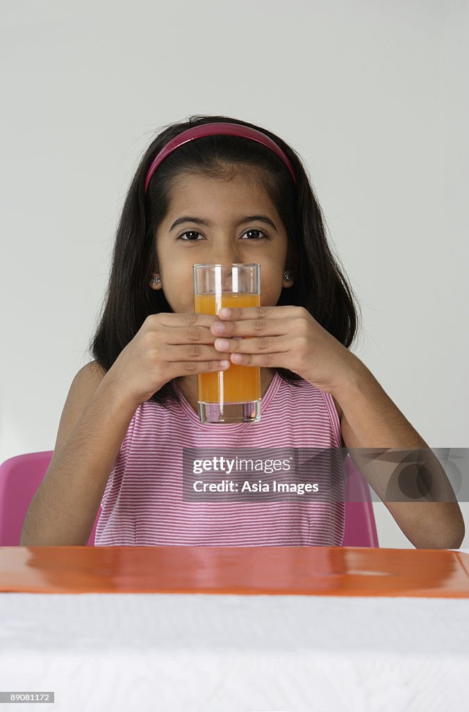 Girl with glass of juice
