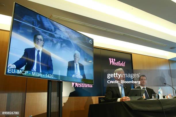 Steven Lowy, co-chief executive officer of Westfield Corp., seated left, speaks as Elliott Rusanow, chief financial officer, looks on while Peter...