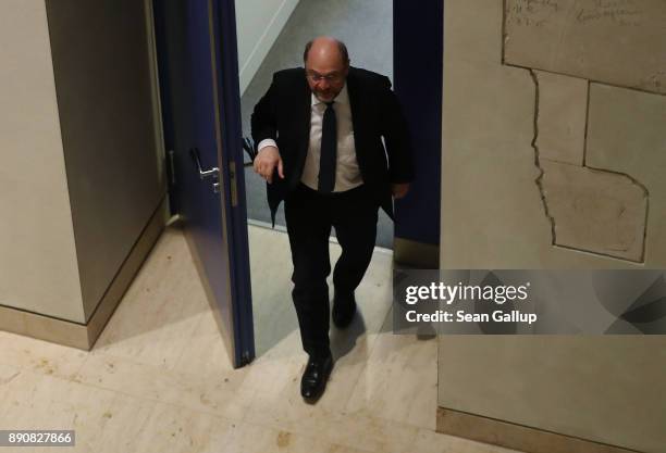 Martin Schulz, head of the German Social Democrats , leaves a room at the Bundestag after meeting in private with German Chancellor and leader of the...