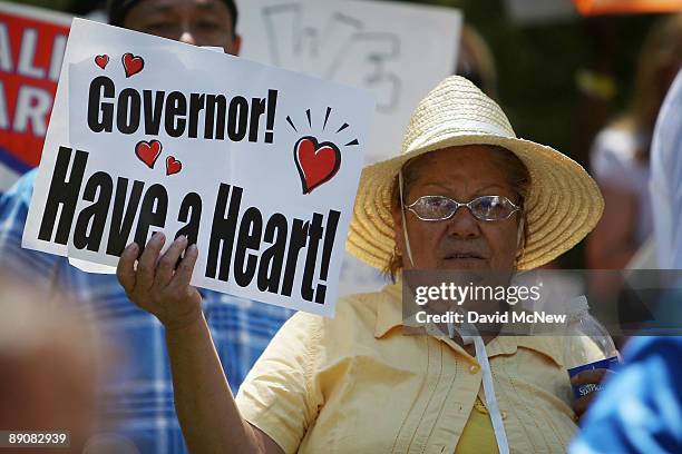 Protesters demonstrate against cuts to social services that aid people with disabilities and the poor at the home of California Gov. Arnold...