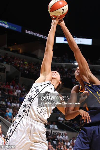 Megan Frazee of the San Antonio Silver Stars shoots against Sandrine Gruda of the Connecticut Sun on July 17, 2009 at the AT&T Center in San Antonio,...