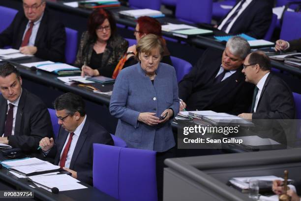 German Chancellor and leader of the German Christian Democarts Angela Merkel attends debates and votes at the Bundestag over German foreign military...