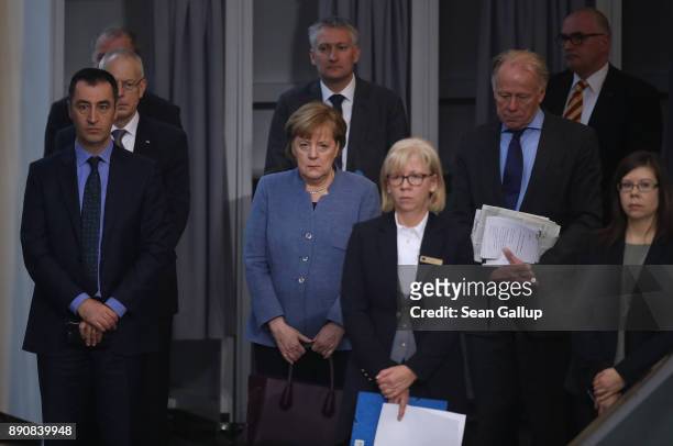 German Chancellor and leader of the German Christian Democarts Angela Merkel pauses for a moment of silence for a deceased colleague prior to debates...