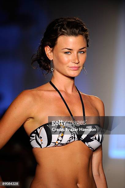 Model walks the runway at the Aqua Di Lara 2010 fashion show during Mercedes-Benz Fashion Week Swim at the Oasis at The Raleigh on July 17, 2009 in...